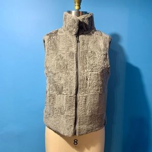 Adrienne Landau fur vest with baby blue lining.